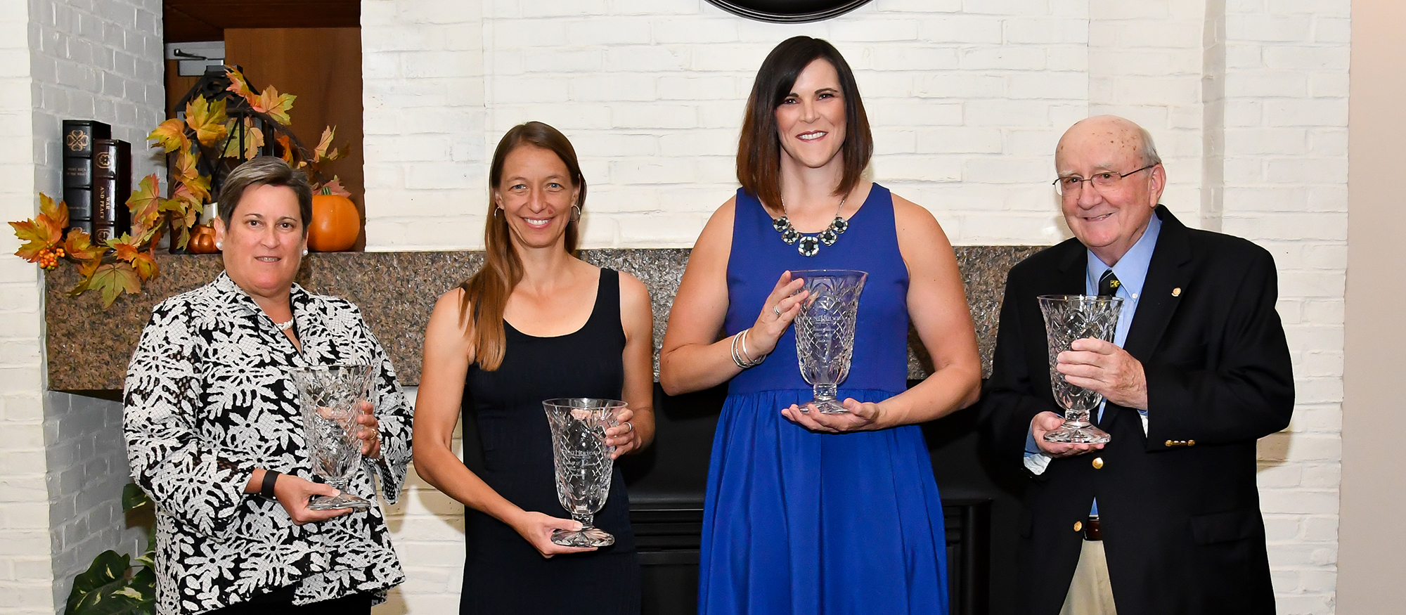 Photo of the Mount Holyoke Athletics Hall of Fame Class of 2017. Left to right pictured are Jean Osachuk '80, Michelle Johannes '93, Jessica Justice '03 and Bob Bontempo.