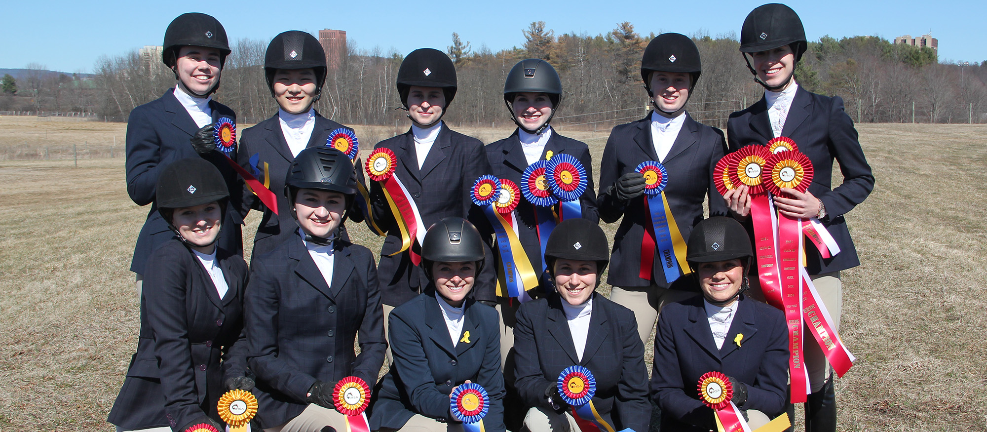 Group photo of the Lyons riding team following competition at the Regional Championships