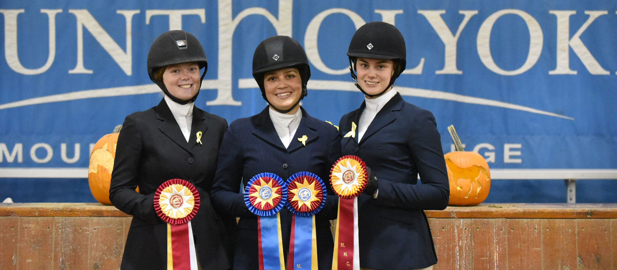 Photo of Lyons riding student-athletes Sara Hearn, Indra Rapinchuk-Souccar and Sierra Dunn following the October 27th, 2018 Home Show.