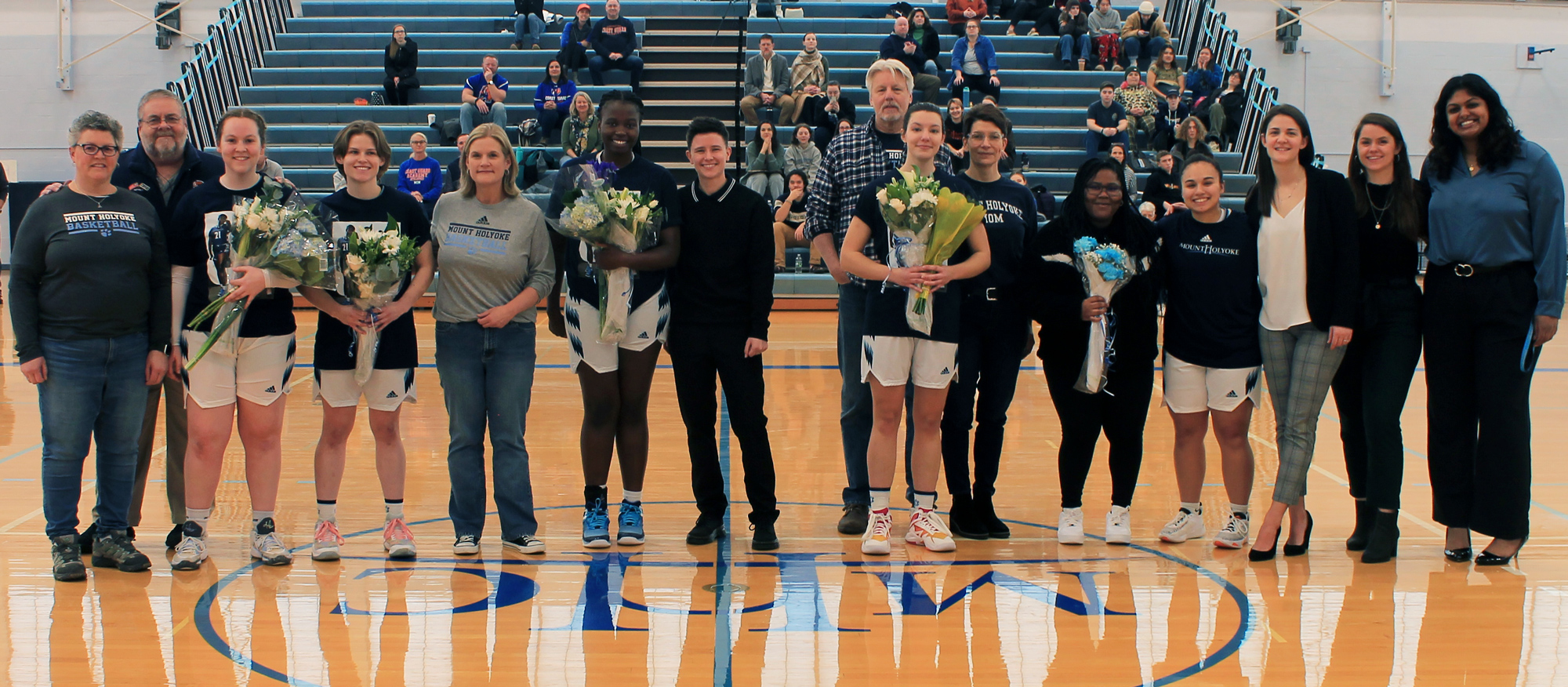 Mount Holyoke seniors, their families and guests, and the Lyons coaching staff on Senior Day, Feb. 17, 2024.