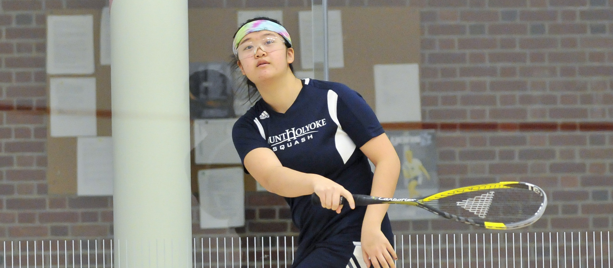 Action photo of Lyons squash player, Emily Chang