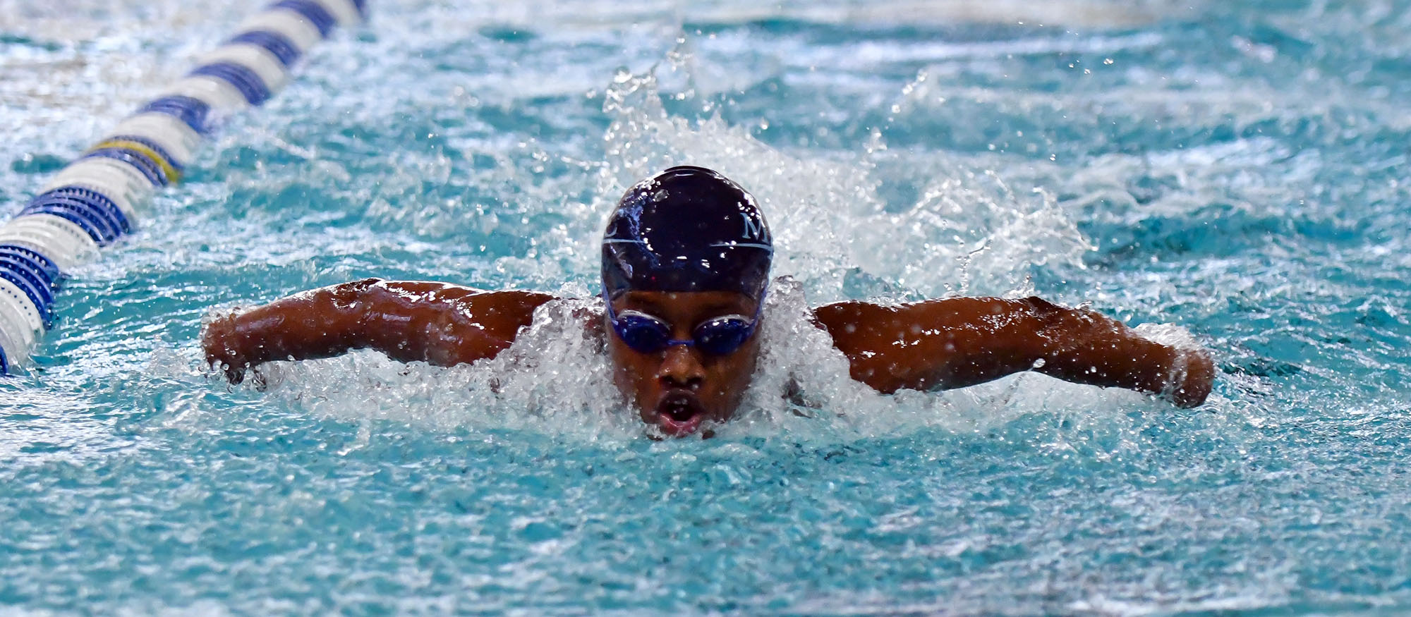 Action photo of Lyons swimmer, Topaz Mukulu.