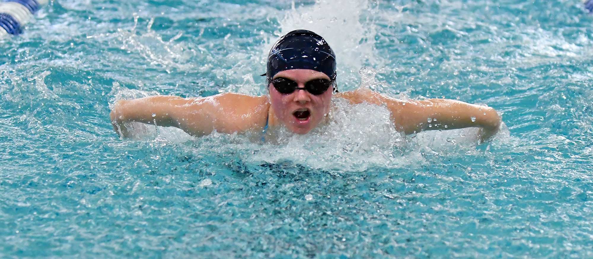 Action photo of Lyons swimmer, Ashton Bliss.