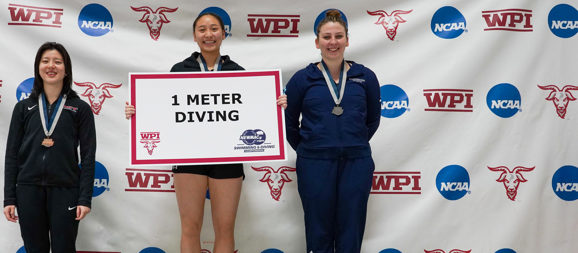 Maddy Sewell (right) finished second in 1-meter diving to win her second All-NEWMAC honor in three days on Feb. 19, 2023 at WPI. (Alex Gutierrez/WPI Athletics)