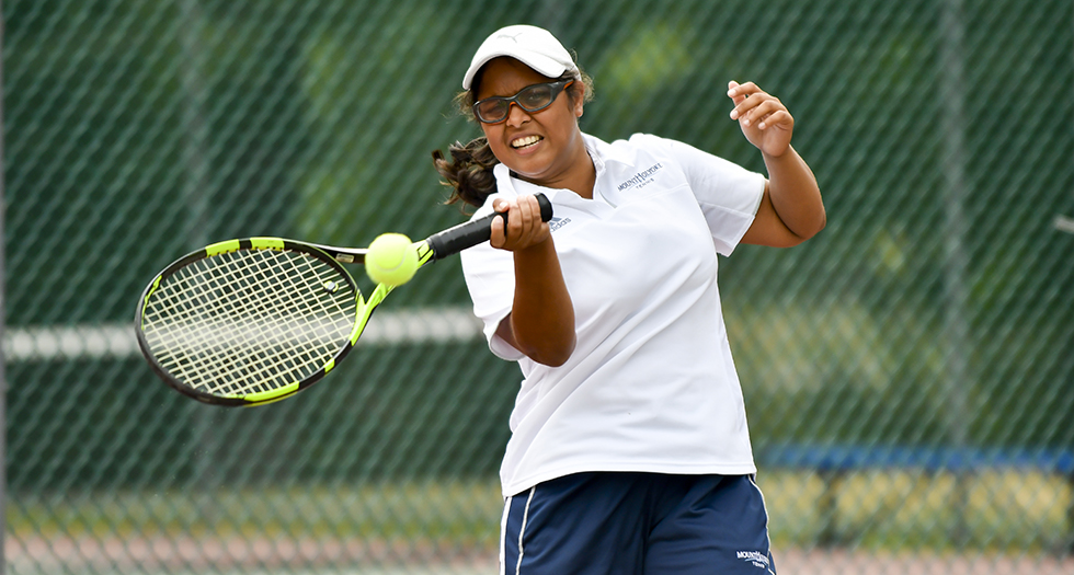 Action photo of senior tennis player Ishita Tibrewal.