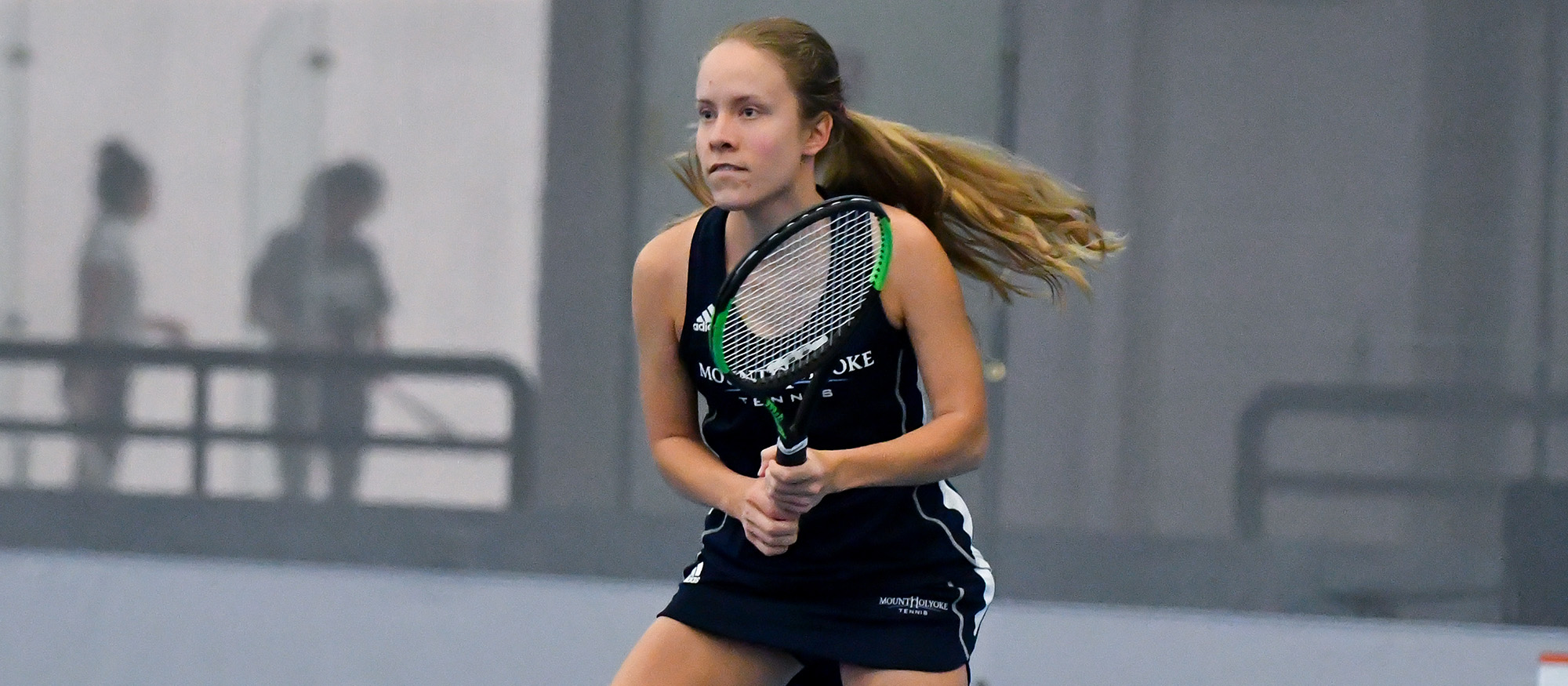 Action photo of Lyons tennis student-athlete, Anya Gerasimova.