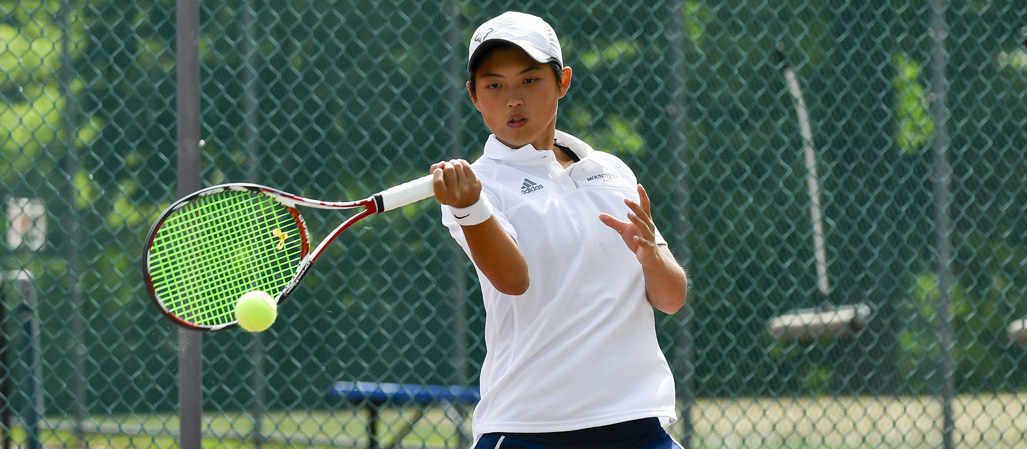 Action photo of Lyons tennis player Ching-Ching Huang