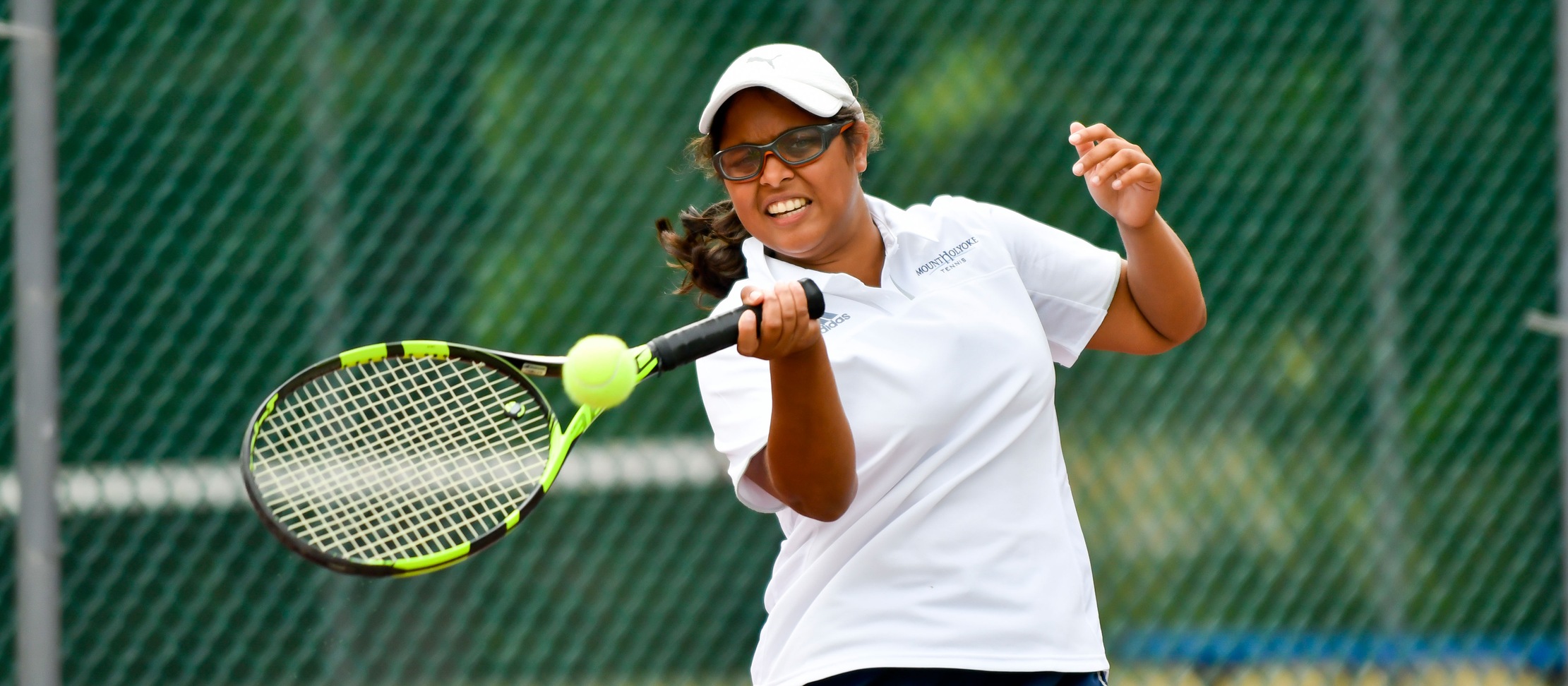 Action photo of Lyons tennis player, Ishita Tibrewal.