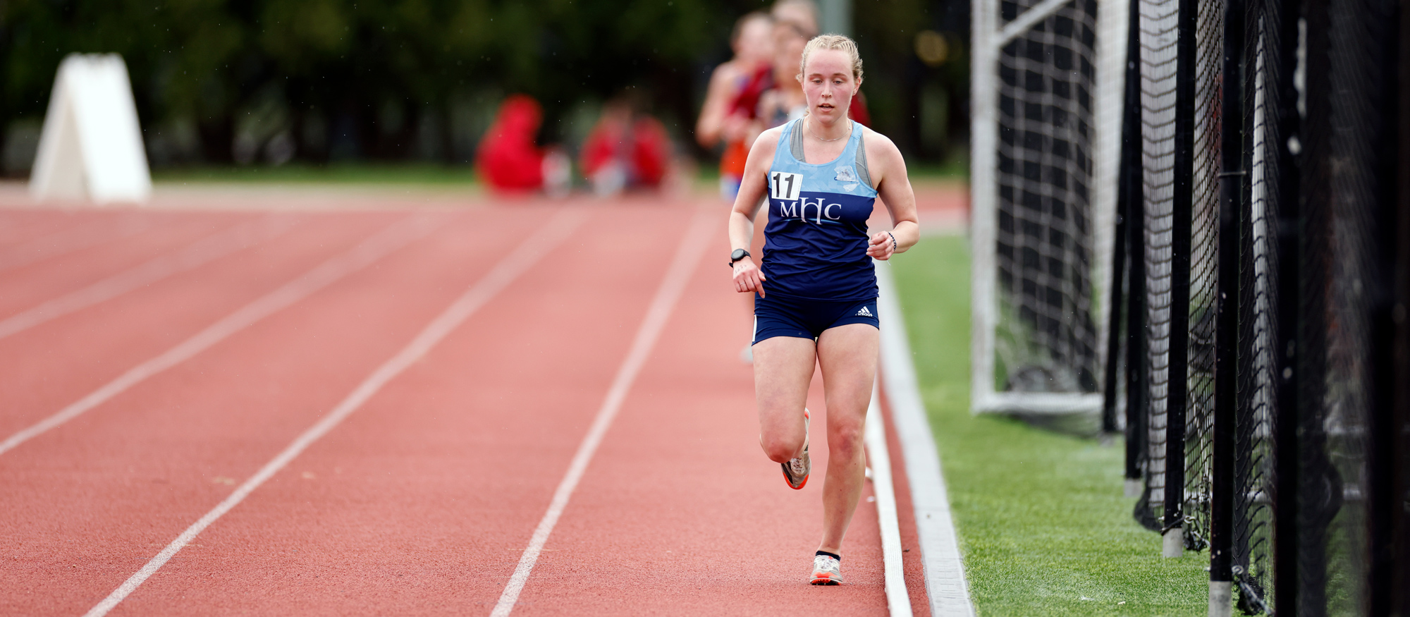 Bridget Hall raced to eighth place in the 10,000 meters at the NEWMAC Track & Field Championships at MIT on April 29, 2023. (Frank Poulin / Courtesy MIT)
