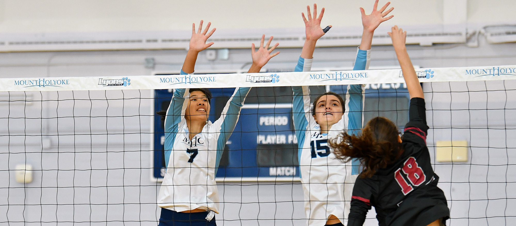 Elle Rimando (left) had three kills and Madeline Barton (right) had a team-high seven in Mount Holyoke's 3-0 loss at Emerson on Oct. 29, 2022. (RJB Sports file photo)