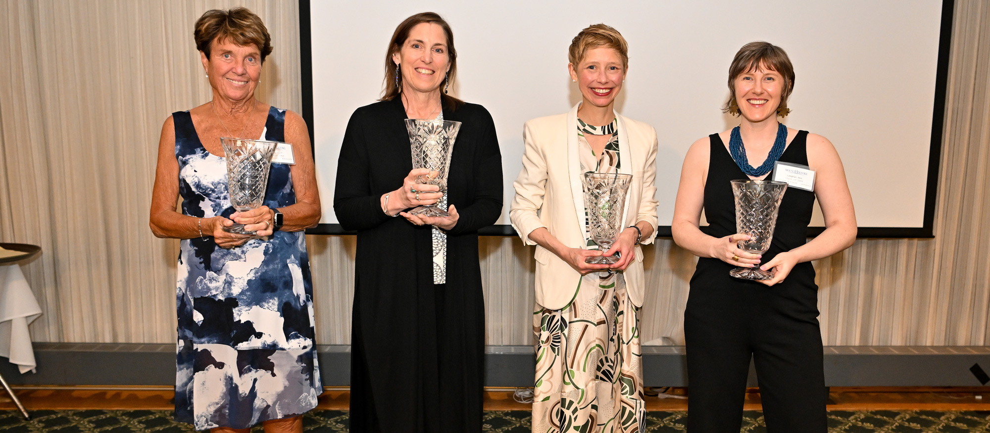 From left to right) Penny Calf '68, Mary Mazzio '83, Catherine Herrold '00, and Langhan Dee '04 were inducted along Elizabeth Kennan '60 (in absentia) into the Mount Holyoke College Athletics Hall of Fame on May 25, 2023. (Bob Blanchard/RJB Sports)