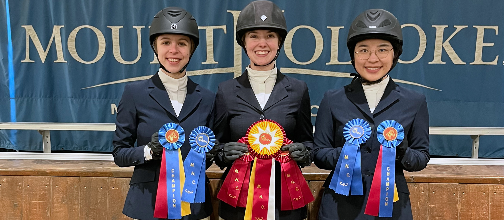 Ribbon winners (left to right) Alex Taylor (High Point Champion Novice Rider), Kristen Adolf (Reserve High Point Limit Rider) and Lingdang Zhang (High Point Introductory Rider) following the Mount Holyoke Show on Feb. 25, 2023.