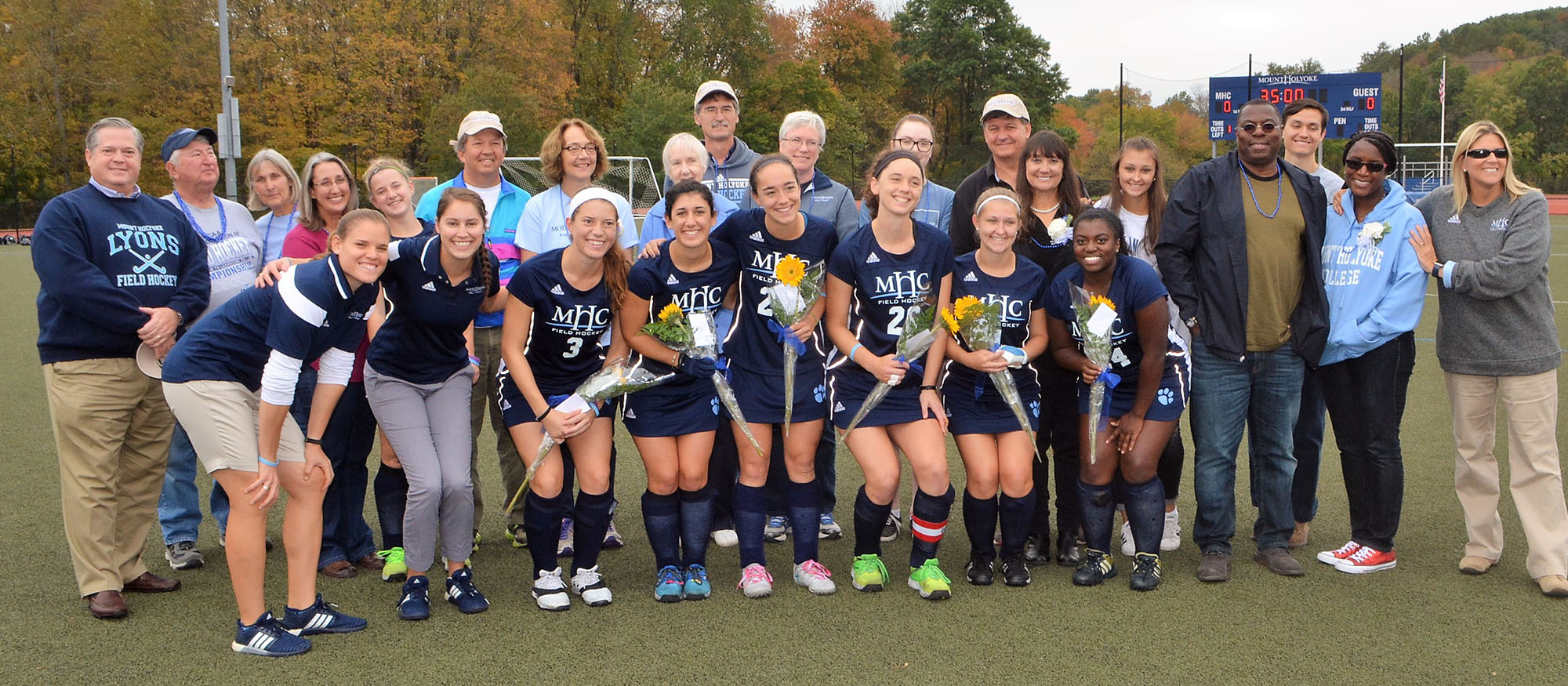 Photo of the Lyons field hockey team's six seniors and their families during a pre-game ceremony on October 14, 2017 against Wheaton.
