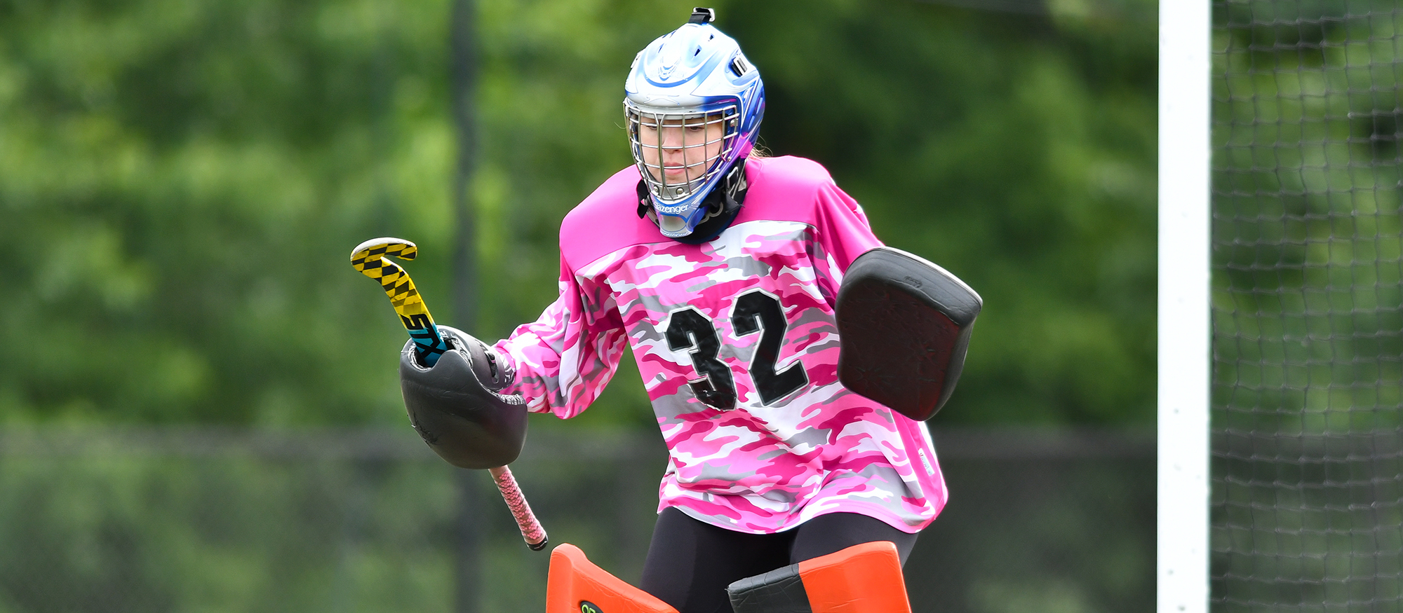 Action photo of Lyons field hockey goalie, Maddie Miller.