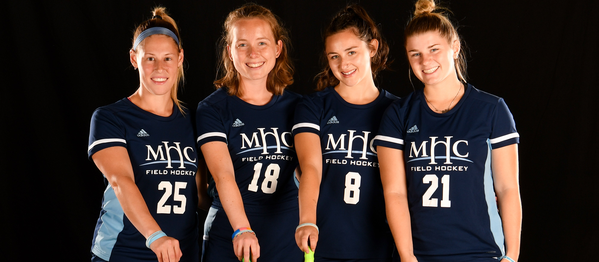 From left to right, Laurissa Montigny, Phoebe Aaronson, Kylie Brooks, and Mollee Malboeuf, Mount Holyoke field hockey's Class of 2023, was honored on Senior Day before their game against Wellesley on Oct. 22, 2022. (RJB Sports file photo)