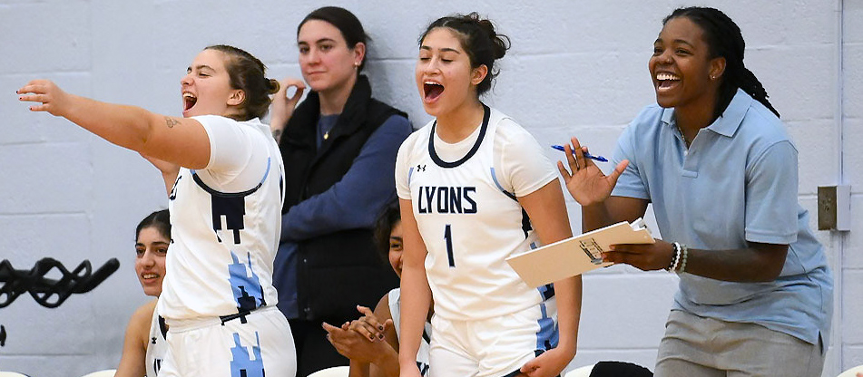 Trinity Bravo (far right) has made an immediate impact as Mount Holyoke basketball's first full-time assistant coach. (Courtesy of Sergej Zoubok)