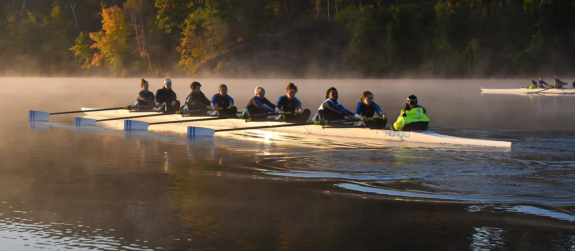 Action photo of the Lyons rowing varsity eight boat from the fall 2017 season.