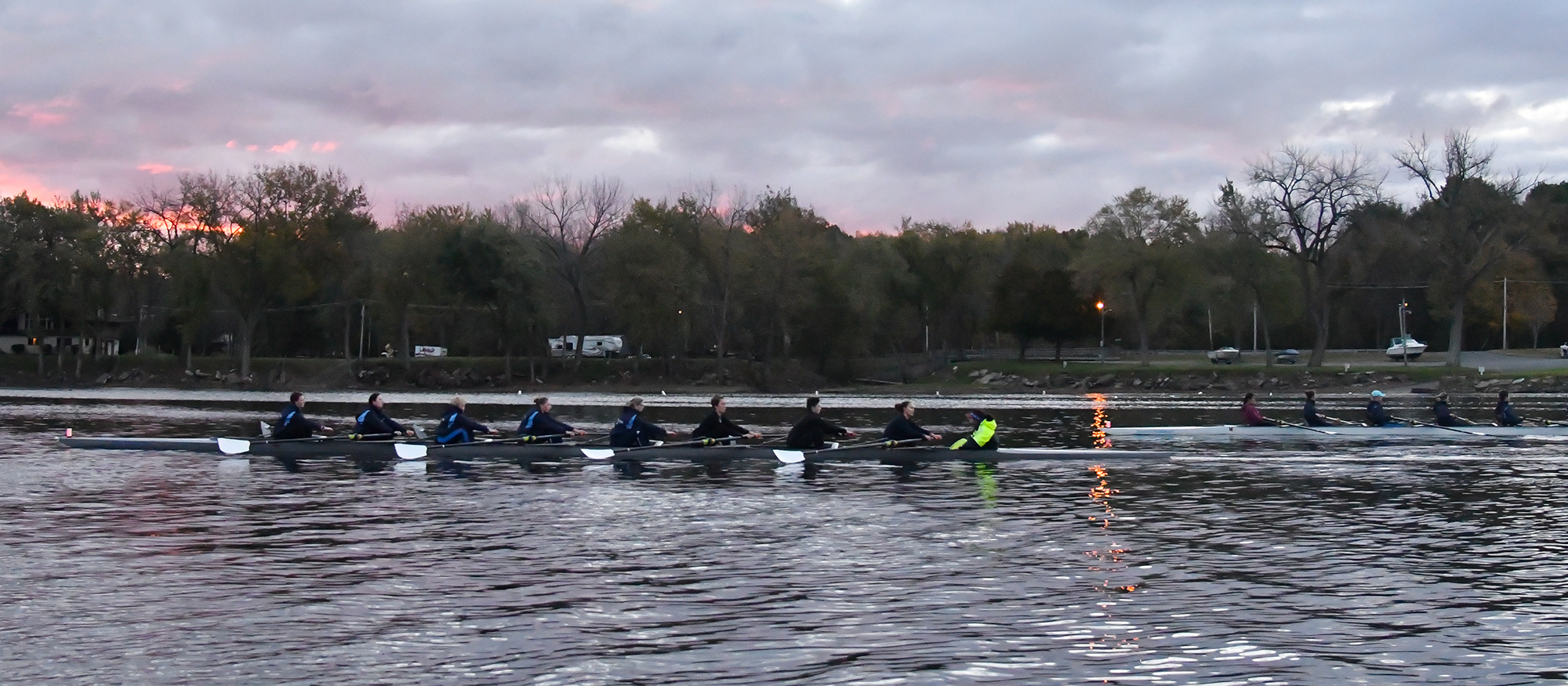 Action photo of the Lyons rowing team on the Connecticut River.