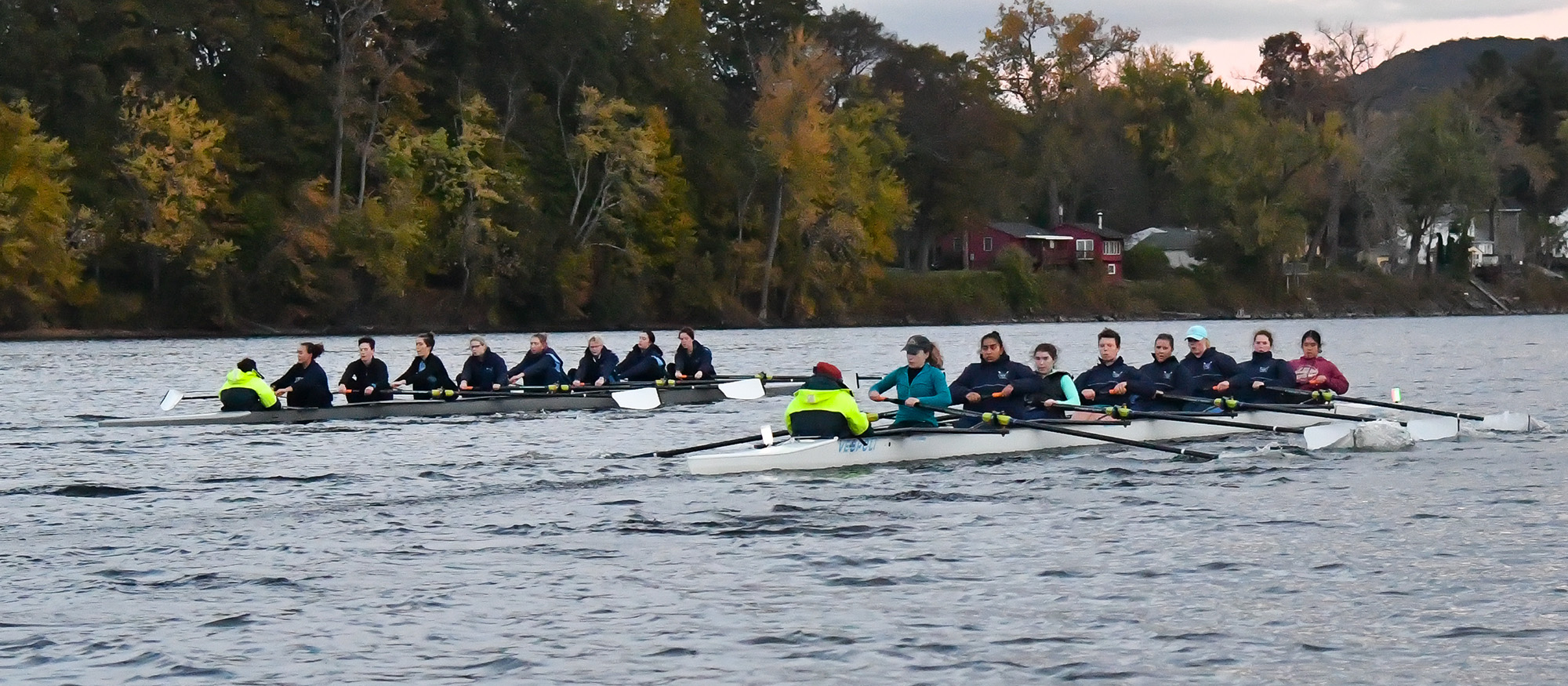 Photo of two Lyons Rowing crews practicing on the Connecticut River.