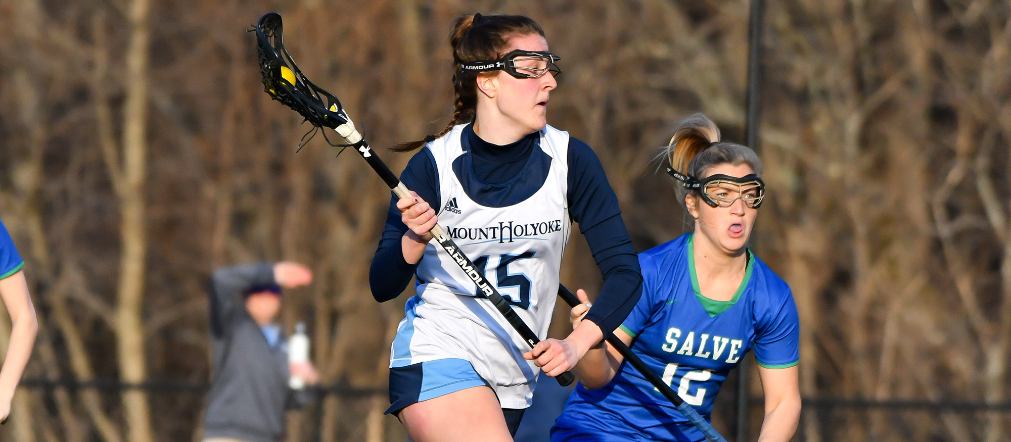 Action photo of Lyons lacrosse player, Abby Baldwin.