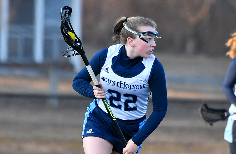 Action photo of Lyons lacrosse player, Allie Brown.