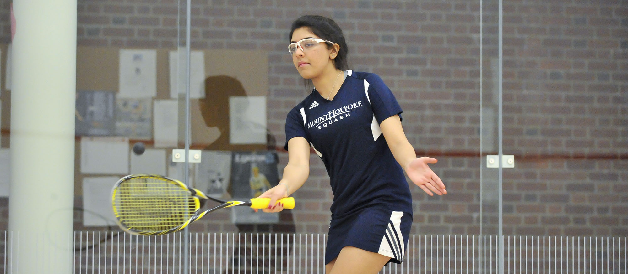 Action photo of Lyons squash player, Ragini Ghose