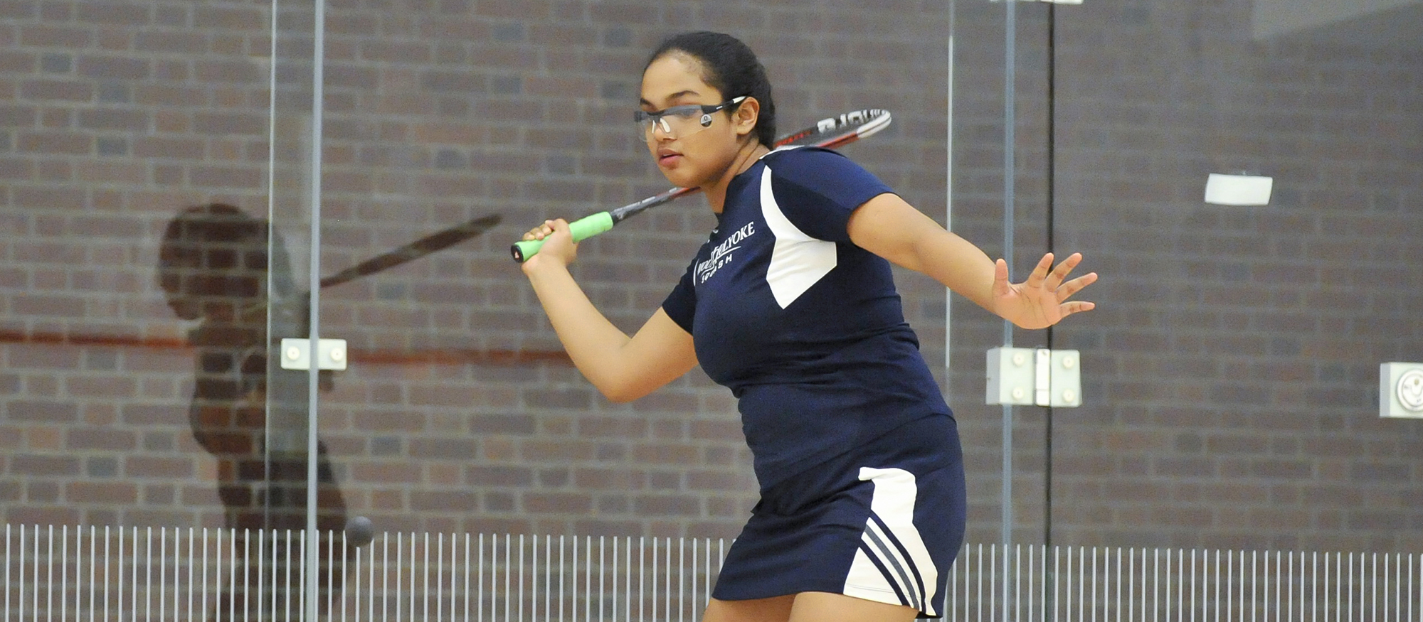 Action photo of Lyons squash player, Tanishka Sachidanand.