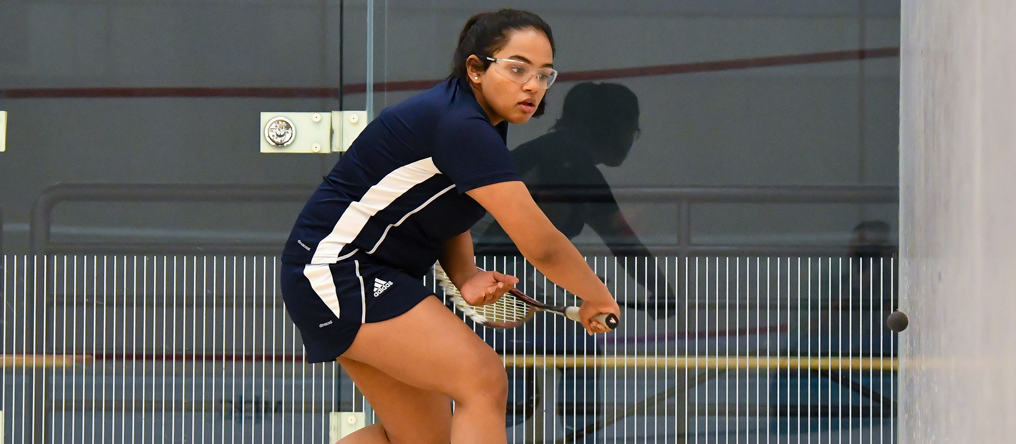 Action photo of Lyons squash player, Tanishka Sachidanand.