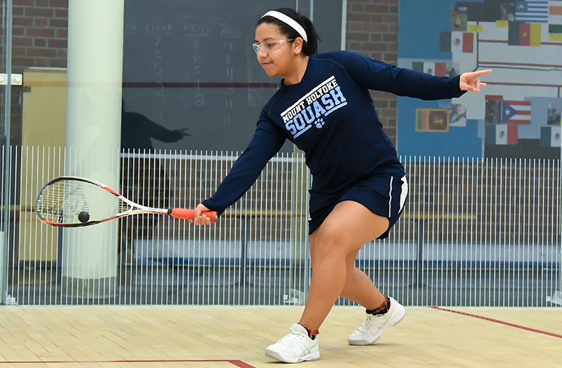 Action photo of Lyons squash player, Giselle Cabrera.