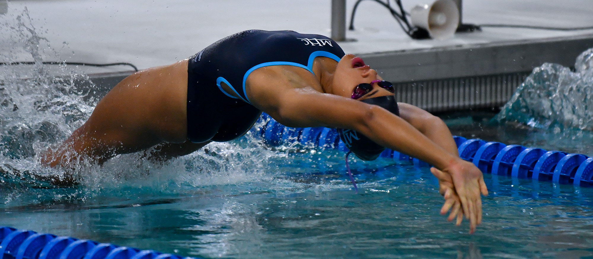 image of an MHC swimmer at the start of the backstroke