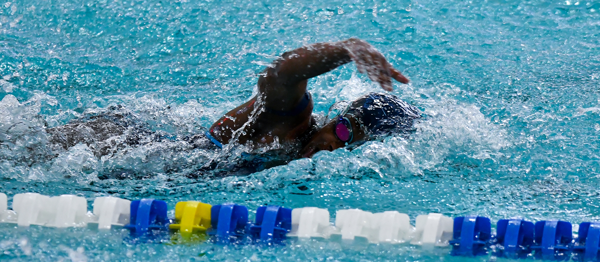 Action photo of Lyons swimmer, Tamara Mukulu