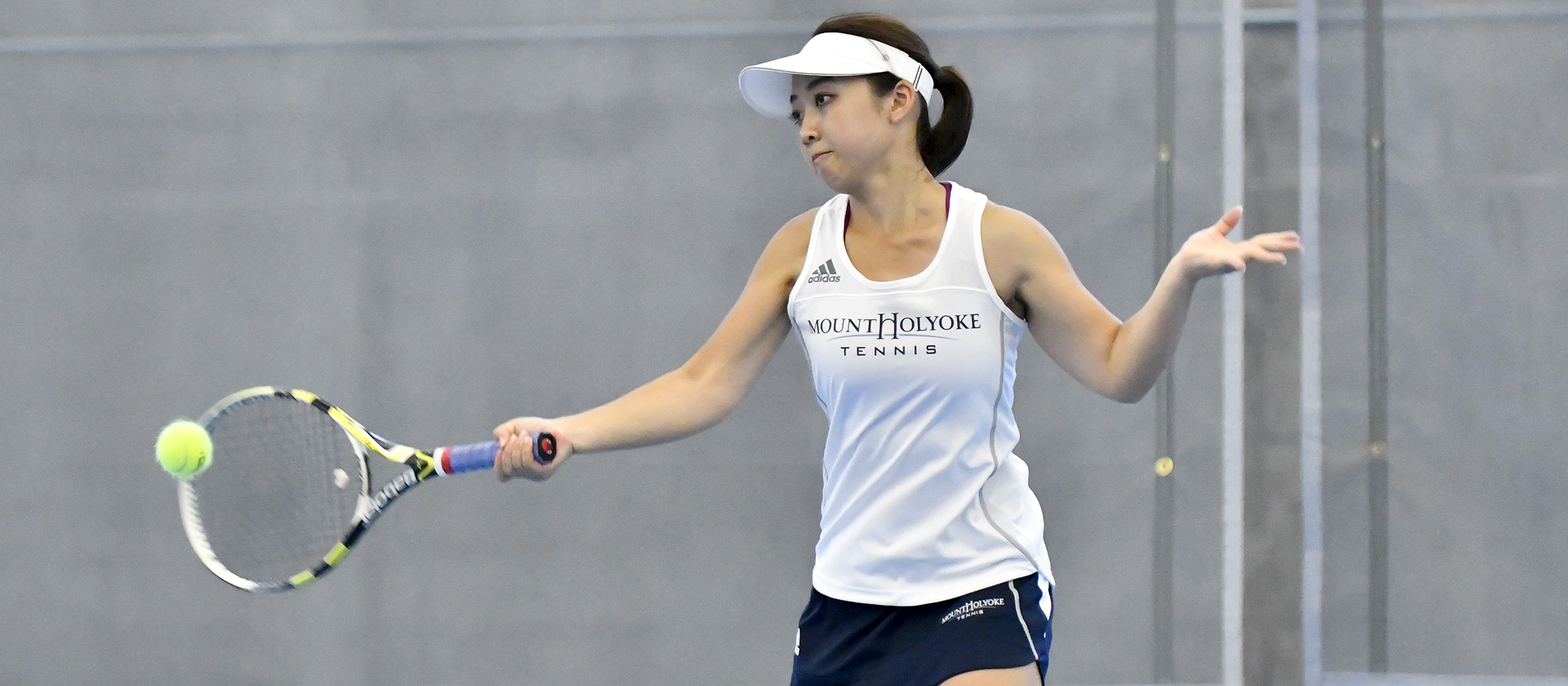 Action photo of Lyons tennis player, Ayame Yazawa.