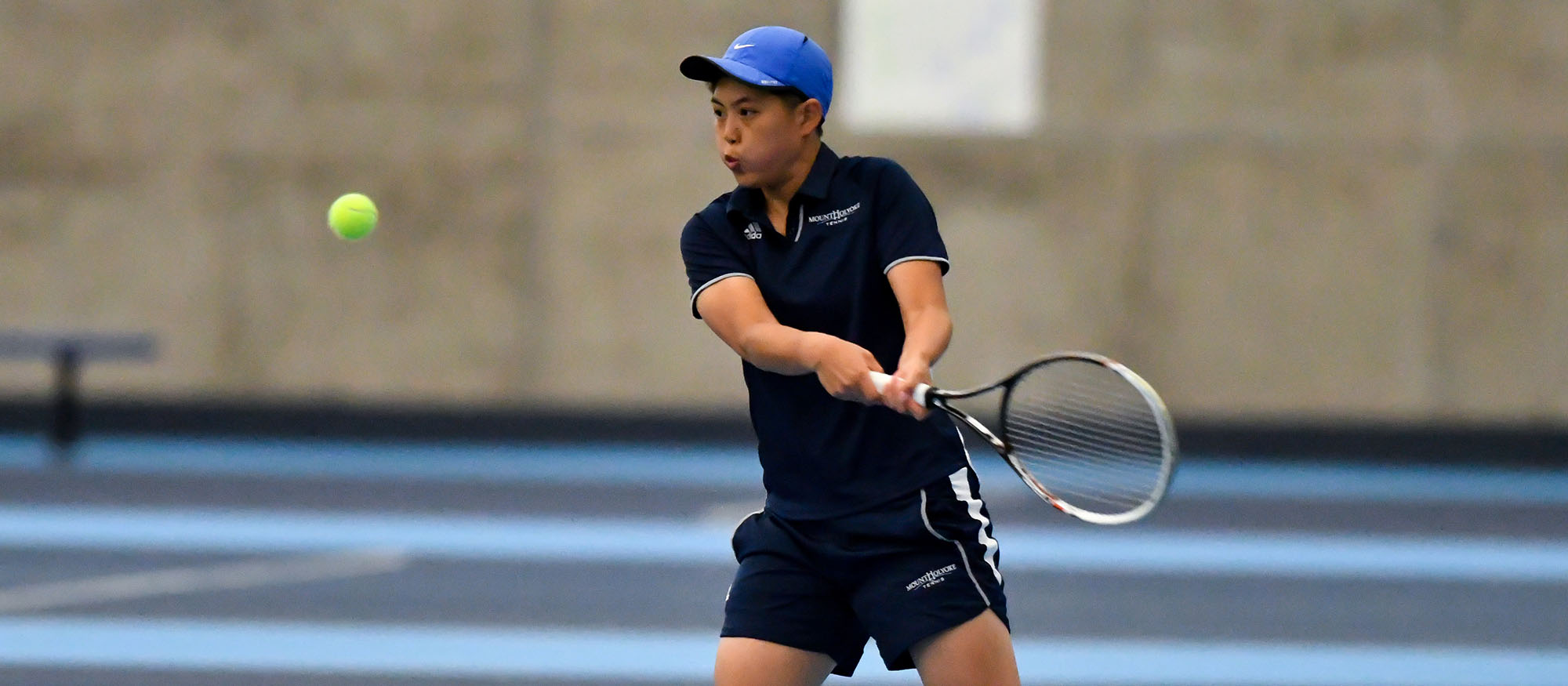 Action photo of Lyons tennis player, Ching-Ching Huang.