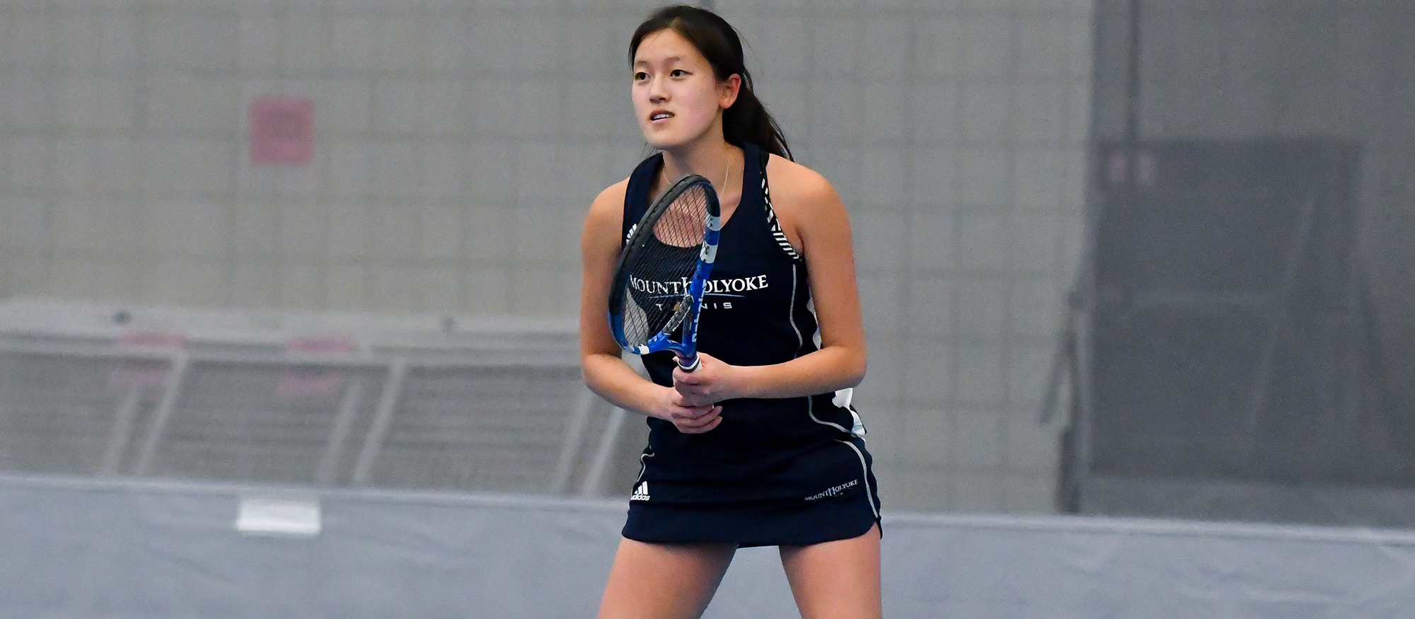 Action photo of Lyons tennis player, Clara Wang