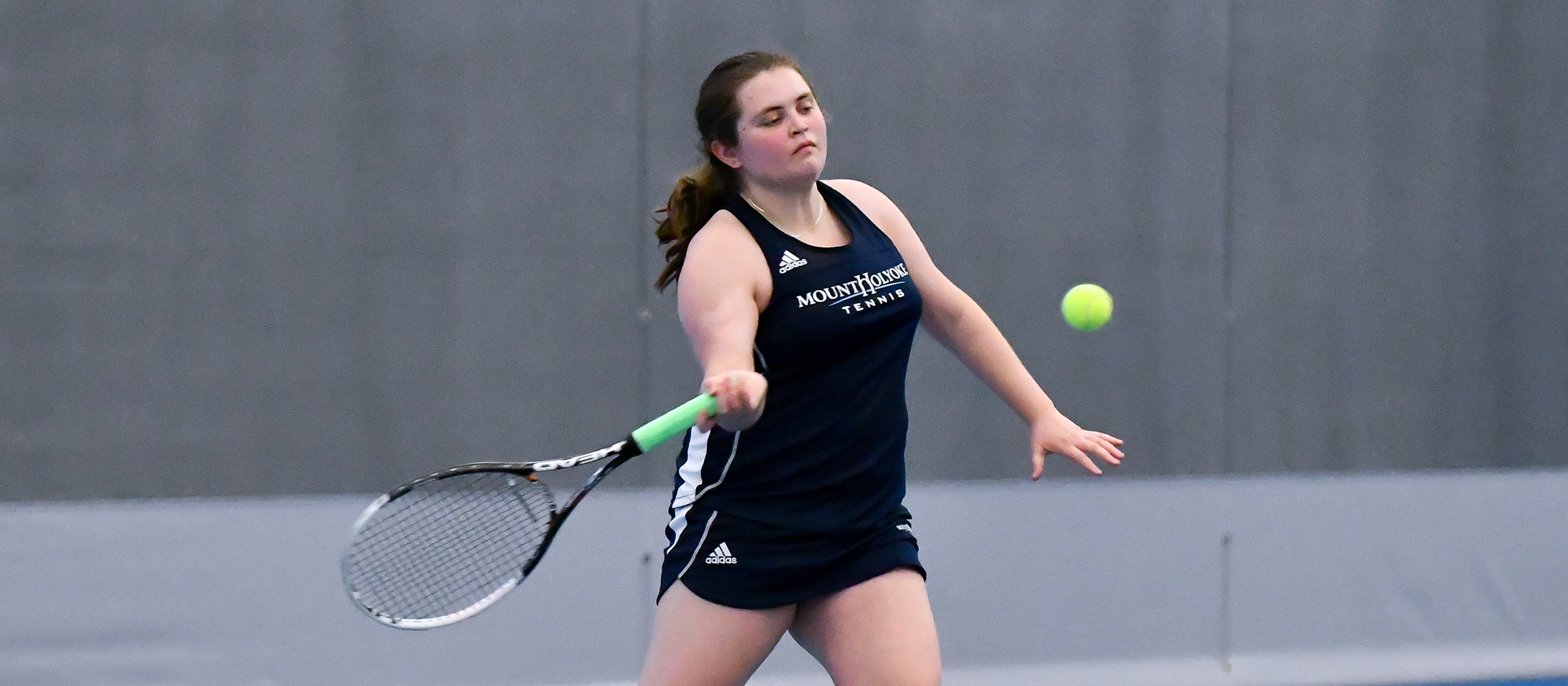 Action photo of Lyons tennis player, Madison Rosen.
