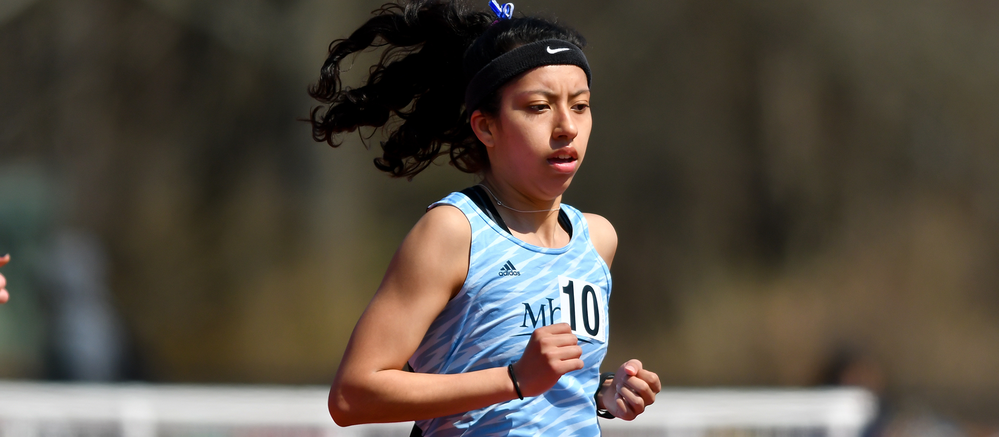 Action photo of Lyons track & field athlete, Michelle Serrano.