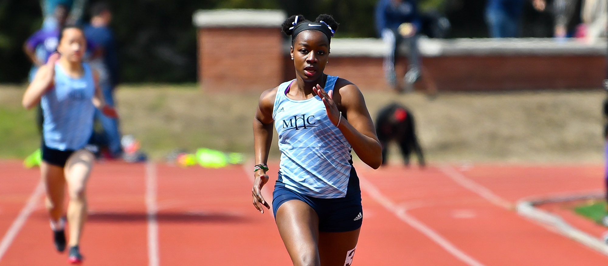 Action photo of Lyons track & field athlete, Tamara Mukulu.