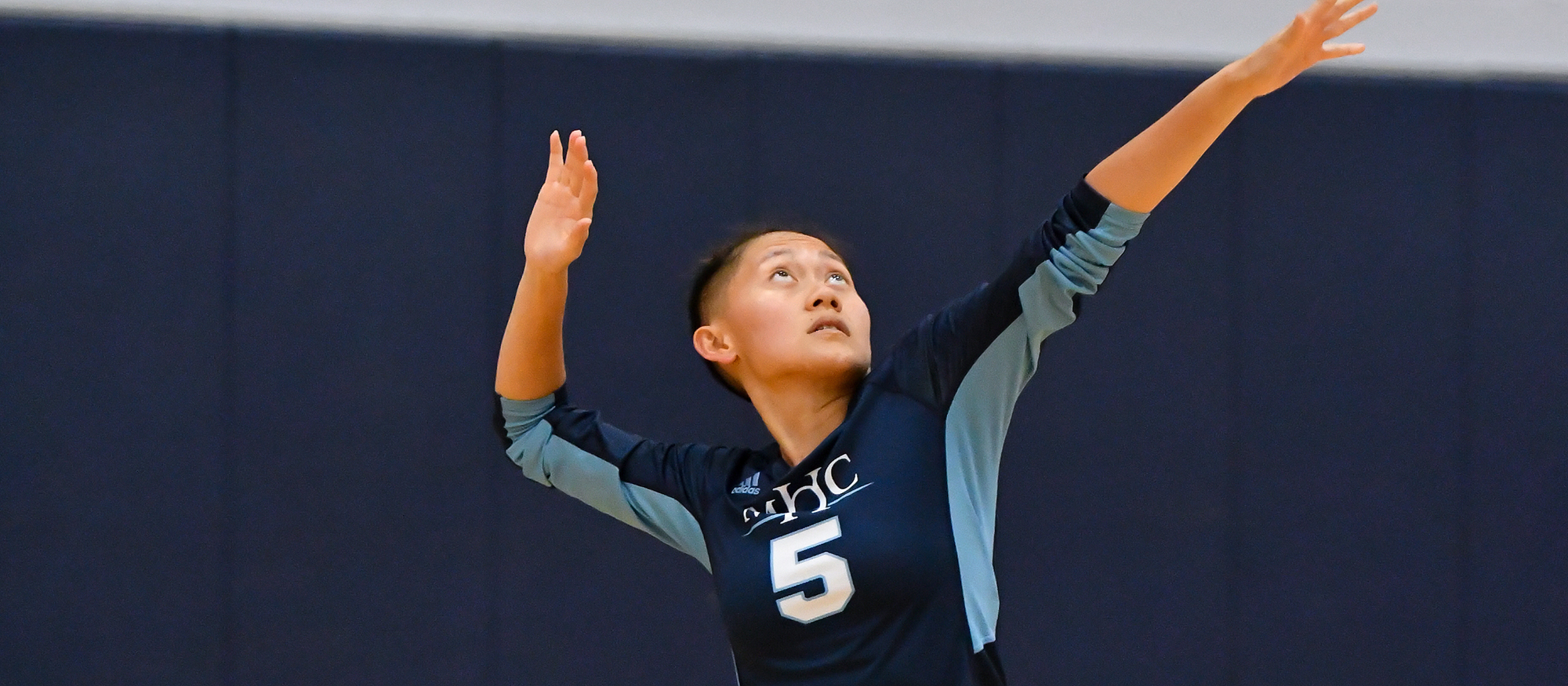 Action photo of Lyons volleyball player, Loriya Thao.