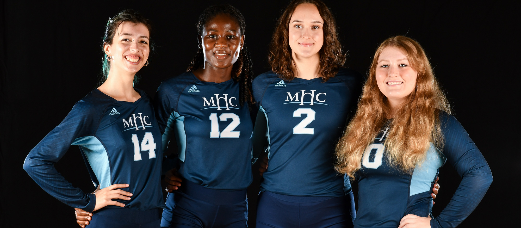 Mount Holyoke volleyball's senior class -- from left to right, Mar Simon, Marion Abeja, McKenna Crosby, and Sierra West -- all contributed to the Lyons' 3-0 win over Emmanuel on Oct. 27, 2022. (RJB Sports)