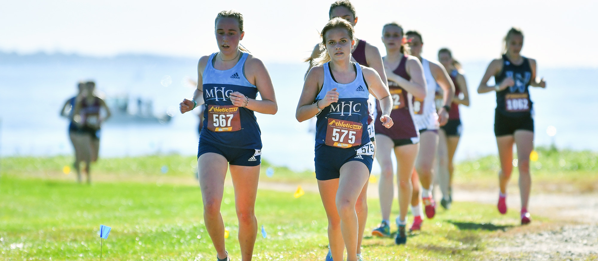 Bridget Hall (left) and Greta Trapp (center) finished second and first, respectively, for Mount Holyoke in the "White Race" at the Connecticut College Invitational on Oct. 15, 2022. (Bob Blanchard/RJB Sports)