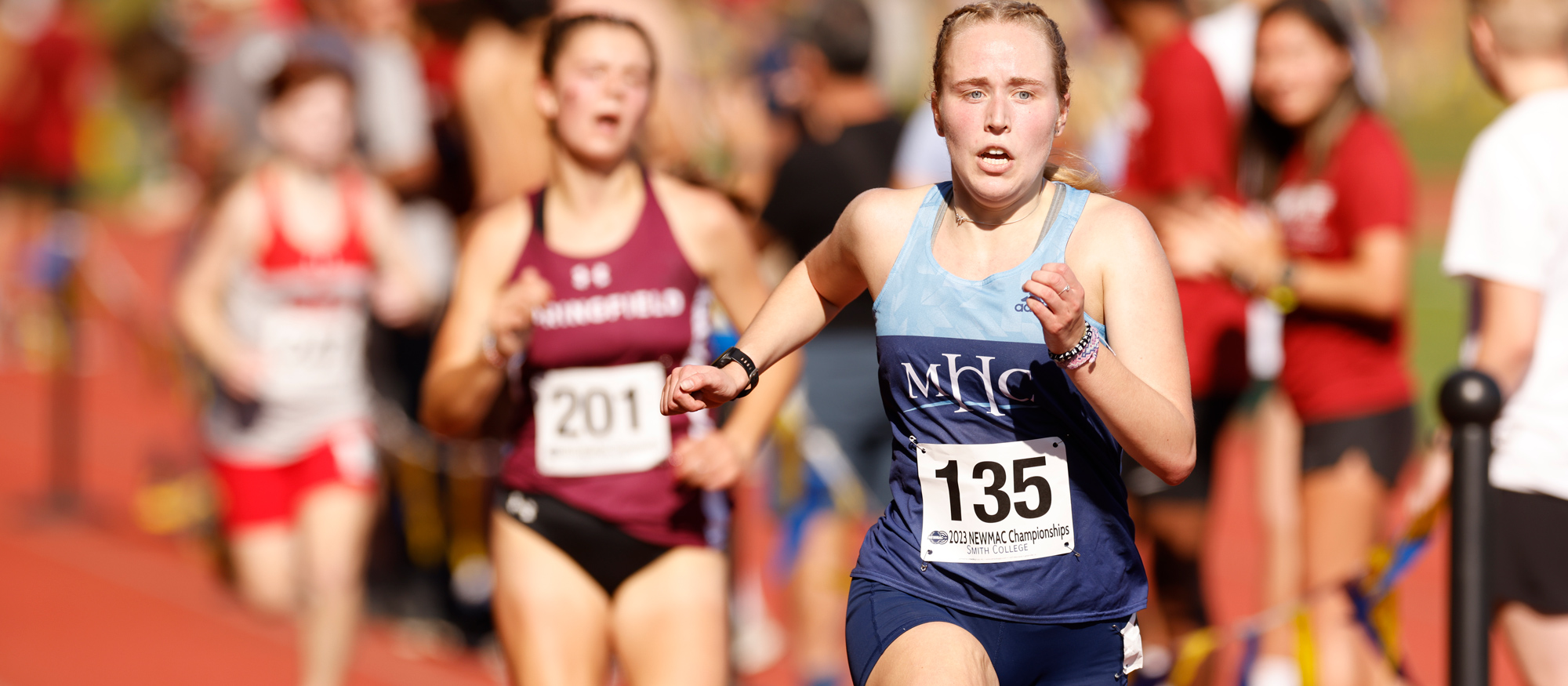 Bridget Hall races to the finish line en route to 38th place out of 118 runners at the NEWMAC Cross Country Championships at Smith College on Oct. 28, 2023. (Frank Poulin/Courtesy of Smith College)